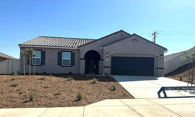 8407 Seth Alexander Way, Bakersfield, CA 93306 - view of front of house with an attached garage, a tiled roof, concrete driveway, and stucco siding