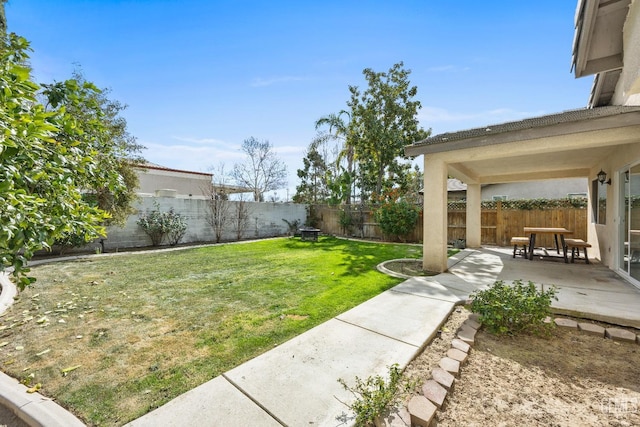 view of yard featuring a patio and a fenced backyard