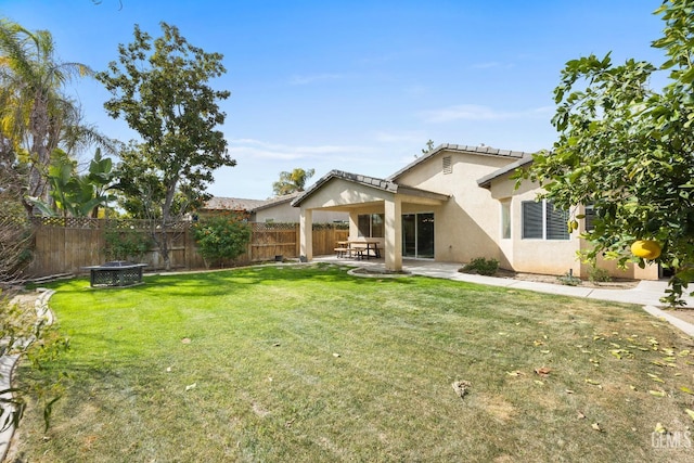 view of yard featuring a fenced backyard and a patio area