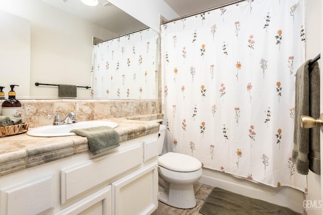 bathroom with toilet and vanity