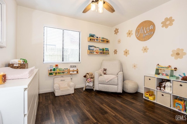 recreation room with ceiling fan and dark hardwood / wood-style floors