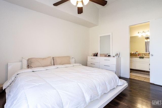 bedroom featuring ceiling fan, dark wood-type flooring, and ensuite bath