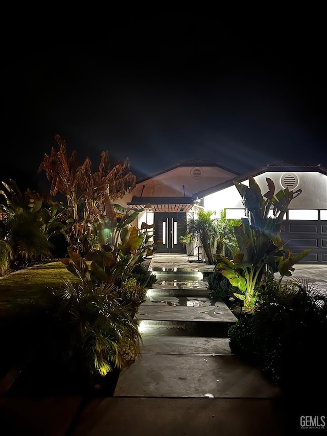 patio at night with a garage