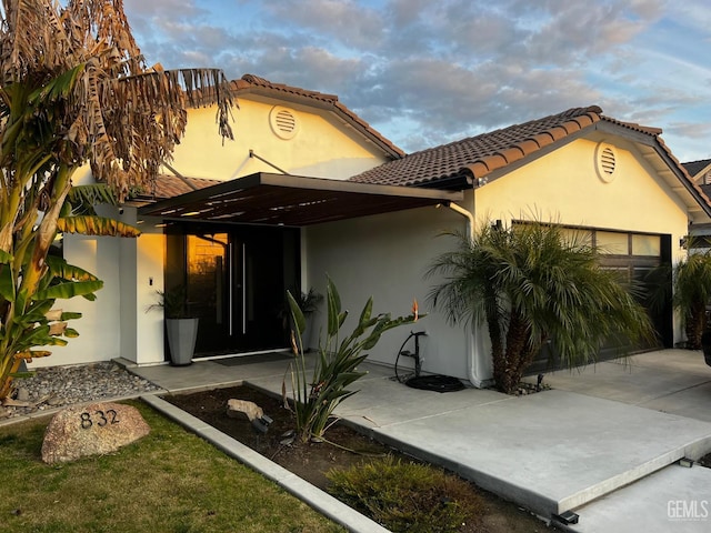 view of front of home with a carport