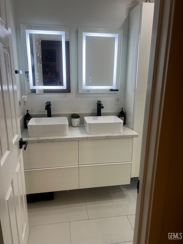 bathroom featuring tile patterned flooring and vanity