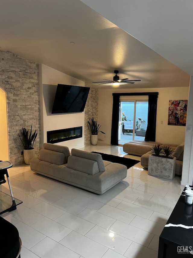 tiled living room featuring ceiling fan