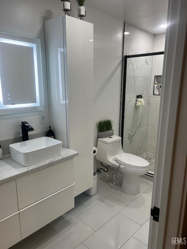 bathroom featuring vanity, a shower with door, and toilet