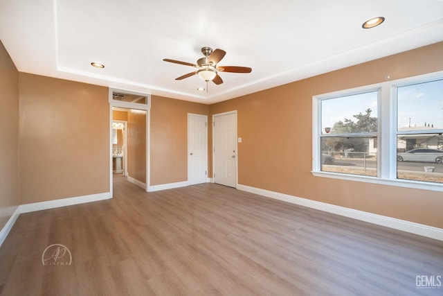 spare room featuring hardwood / wood-style flooring and ceiling fan