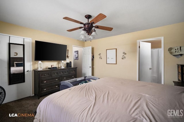 bedroom featuring ceiling fan and dark carpet