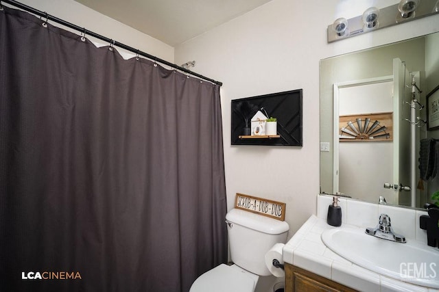 full bath featuring toilet and vanity