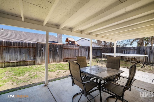 view of patio / terrace featuring outdoor dining area and a fenced backyard