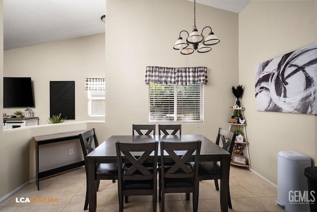 tiled dining room with lofted ceiling, baseboards, and a notable chandelier