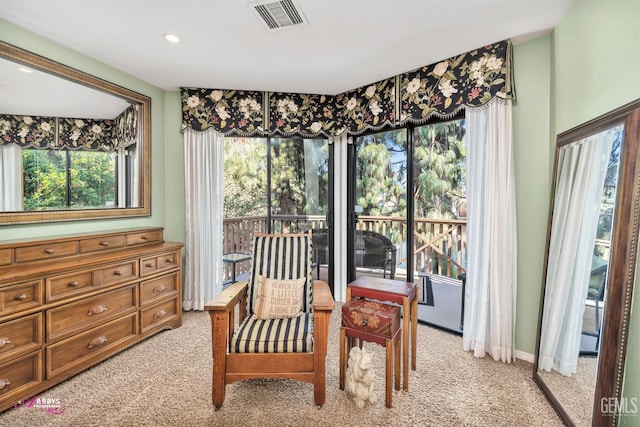 sitting room with light colored carpet