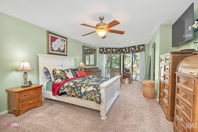 carpeted bedroom with access to outside and ceiling fan