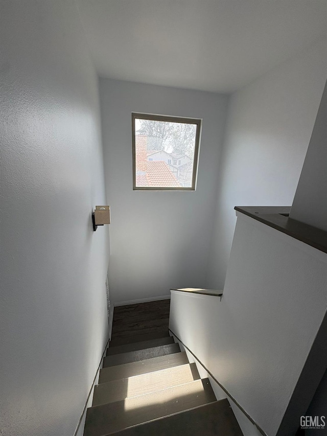 5308 Eastridge Ct, Bakersfield, CA 93306 - staircase featuring wood finished floors and baseboards
