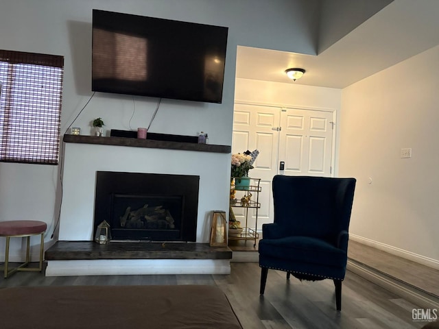 5308 Eastridge Ct, Bakersfield, CA 93306 - living room featuring a fireplace with raised hearth, wood finished floors, and baseboards