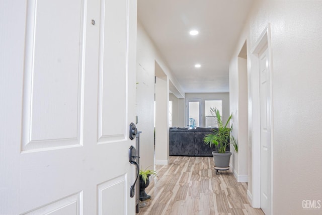 hallway with light wood-type flooring