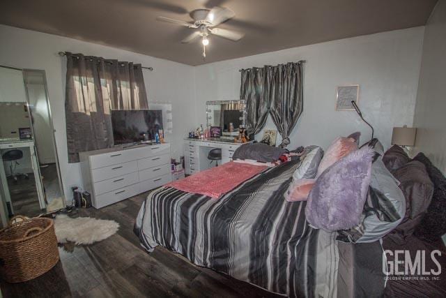 bedroom featuring hardwood / wood-style flooring and ceiling fan