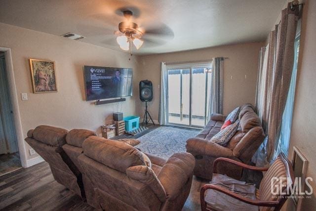 living room featuring ceiling fan and wood-type flooring