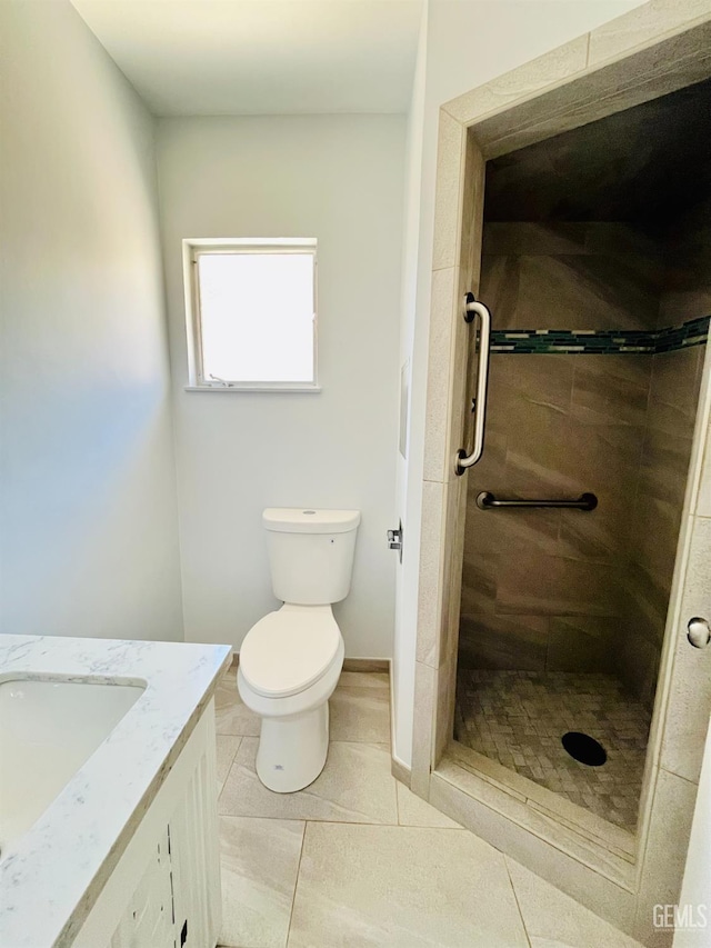 2301 Tangerine St, Bakersfield, CA 93306 - bathroom with vanity, a tile shower, and tile patterned floors