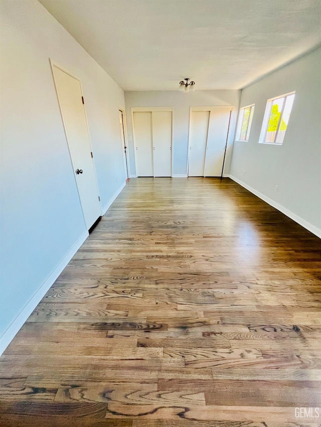 2301 Tangerine St, Bakersfield, CA 93306 - unfurnished bedroom with wood finished floors and multiple closets