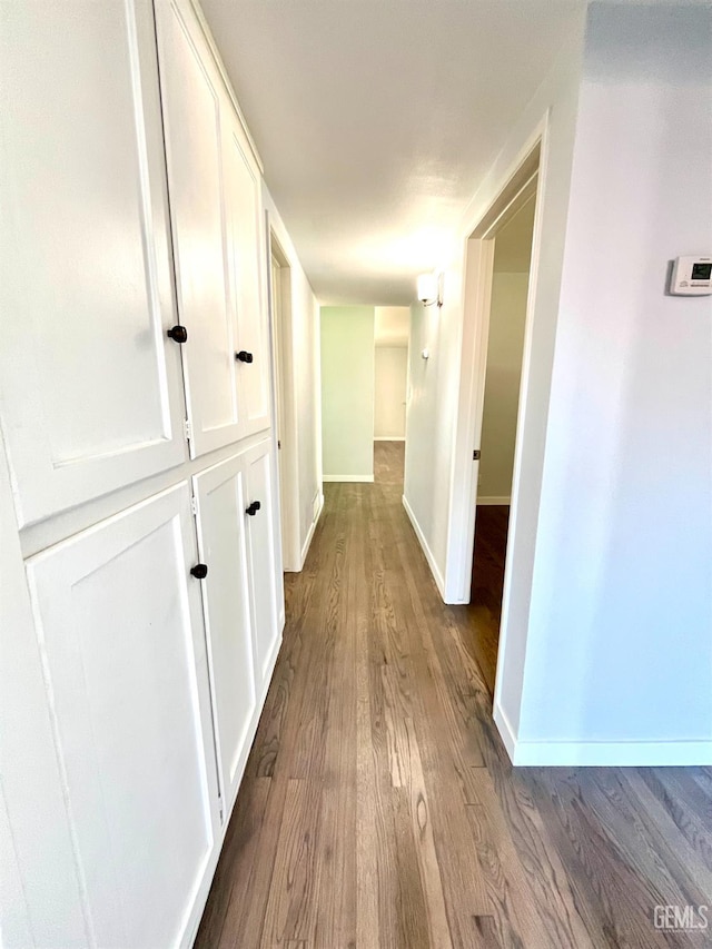 2301 Tangerine St, Bakersfield, CA 93306 - hallway with dark wood-style flooring and baseboards