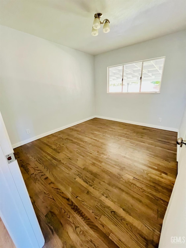 2301 Tangerine St, Bakersfield, CA 93306 - unfurnished room with wood finished floors and a chandelier