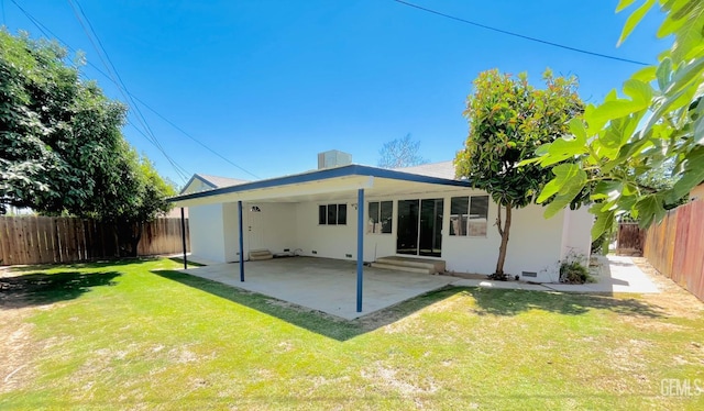 2301 Tangerine St, Bakersfield, CA 93306 - back of property featuring entry steps, a fenced backyard, a patio area, and stucco siding