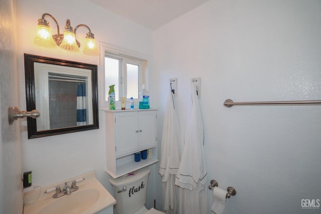 bathroom with vanity and toilet