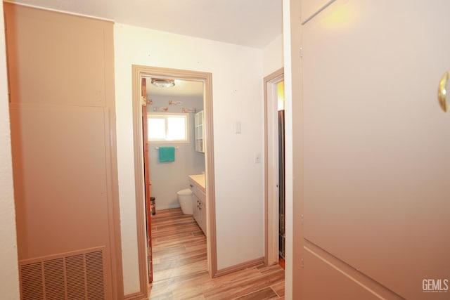 hallway featuring light hardwood / wood-style flooring