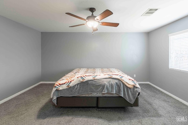 bedroom with ceiling fan and carpet flooring