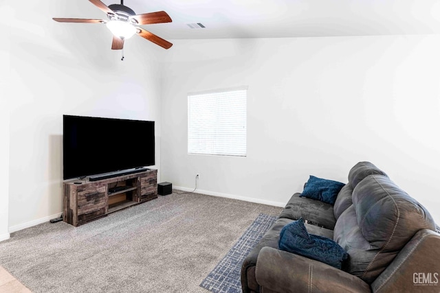 carpeted living room with ceiling fan