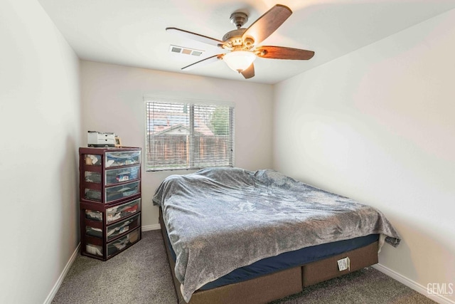 bedroom featuring ceiling fan and carpet