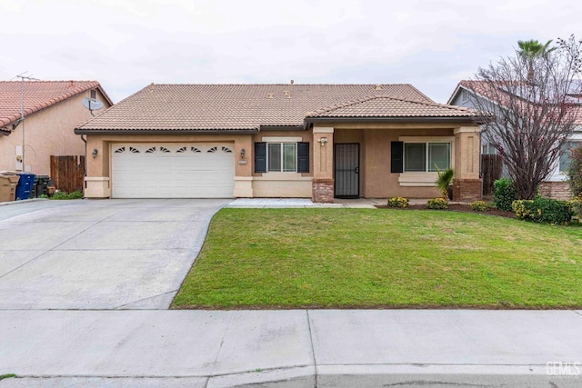 view of front of property with a garage and a front lawn