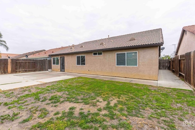 back of property with a patio area