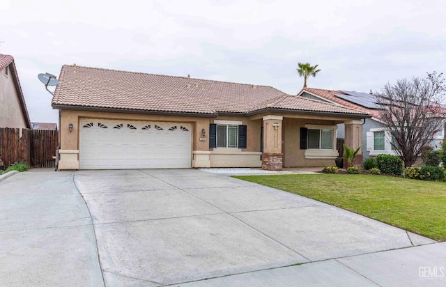 view of front facade with a garage and a front lawn