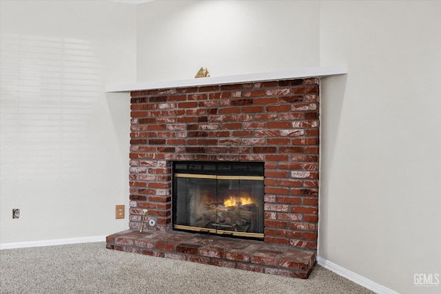 interior details with carpet, a fireplace, and baseboards