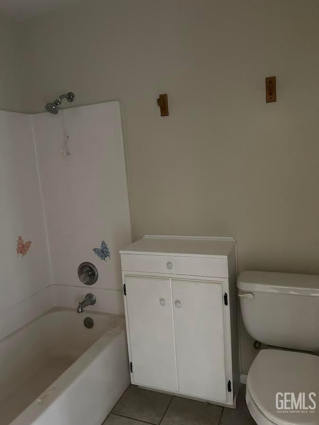 bathroom with tile patterned flooring,  shower combination, and toilet