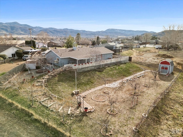 drone / aerial view featuring a residential view and a mountain view