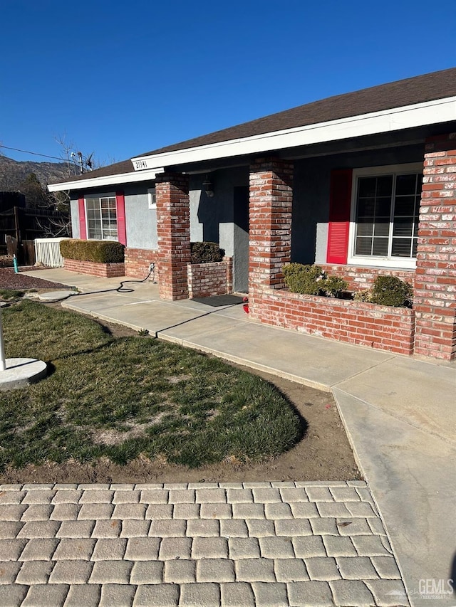 exterior space featuring a front lawn