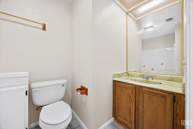 half bath with toilet, baseboards, visible vents, and vanity