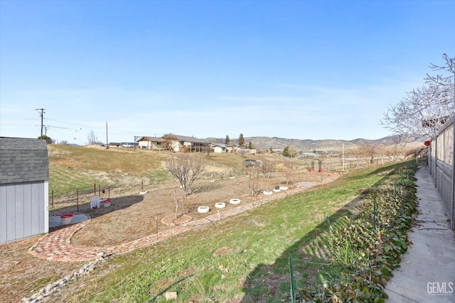 view of yard with an outdoor structure and a storage unit