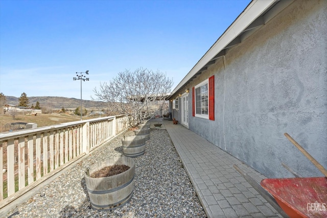 exterior space with a fenced backyard and stucco siding