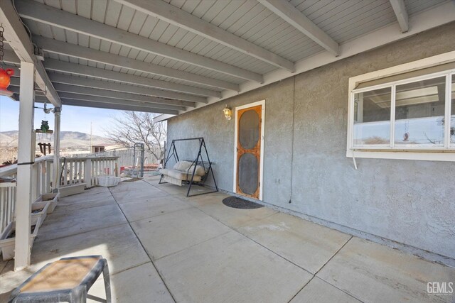 view of patio featuring an attached carport