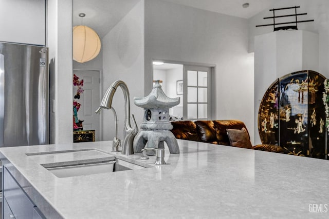 kitchen with vaulted ceiling and sink