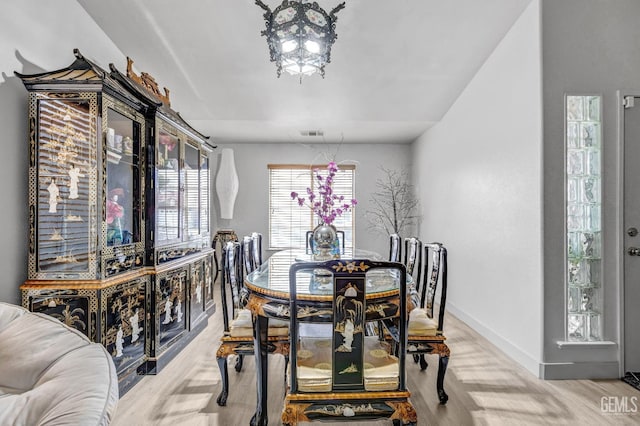 dining room with light wood-type flooring