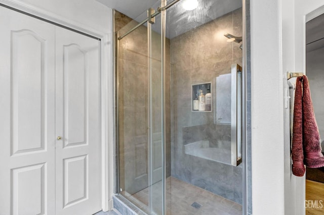 bathroom featuring an enclosed shower