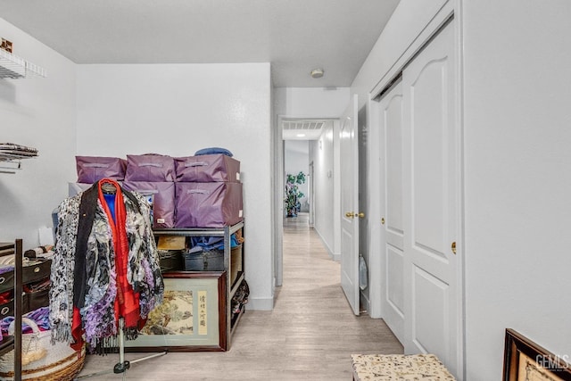 corridor featuring light hardwood / wood-style floors