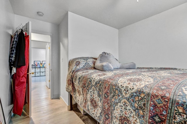 bedroom with light hardwood / wood-style floors