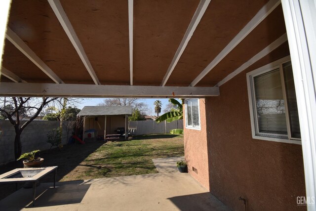 view of patio / terrace featuring a storage shed